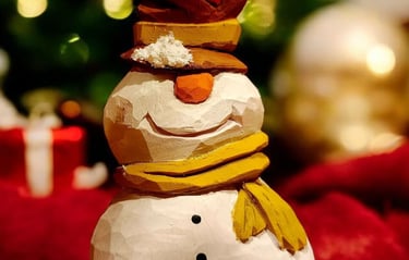 carved snowman J. Smith