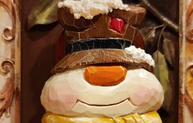 hand carved snowman in basswood with top hat and scarf, carved by James Smith