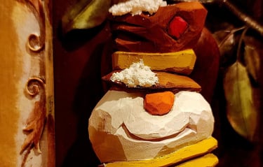 hand carved snowman with tophate and scarf, carved in basswood by James Smith