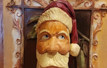 hand carved santa with hate and long curling bear, carved by James Smith