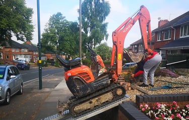 mini digger outside a birmingham home