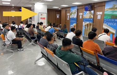 alt="digital advertising screen inside Visa Center waiting area Makati City Philippines"