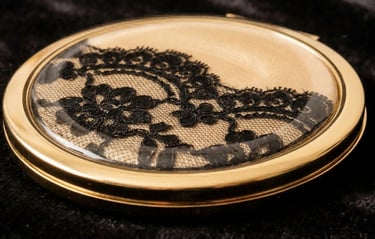 Gold compact mirror with real lace embedded in resin, custom GWP design.