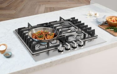 Kitchen stove with food cooking, showcasing a modern cooking setup for meal preparation in home kitchens