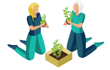 Two women kneeling and holding potted plants while gardening together.
