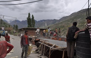 Tracey Billington riding the Leh to Manali highway over the great Himalayan range, Ladakh, India 
