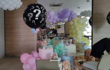 a table with balloons and balloons and balloons