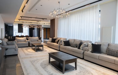 Modern majlis featuring grey sectional sofas