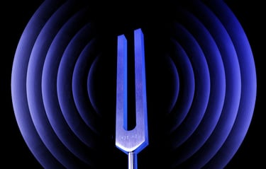Tuning fork with sound waves in the background