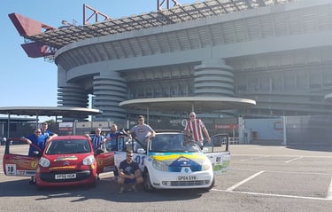 a group of people standing in front of a stadium