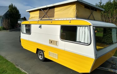 Retro 1980s "little yellow" poptop caravan