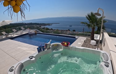 Villa Fay hot tub at pool deck with a view of the ocean