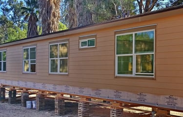Manufactured home built off site with cement siding.