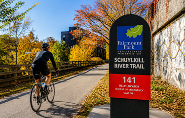 Cyclist riding on the Schuylkill River Trail in Philadelphia