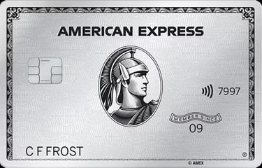 a platinum american express card with a silver card