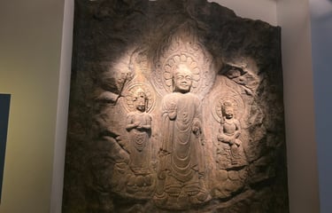 Rock carved Buddha ad Bodhisattvas