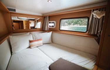 Private luxury yacht cruising through Bacuit Bay, El Nido.