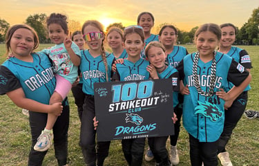 Photo of 9U team celebrating 100 Stirkeouts by pitcher Caroline