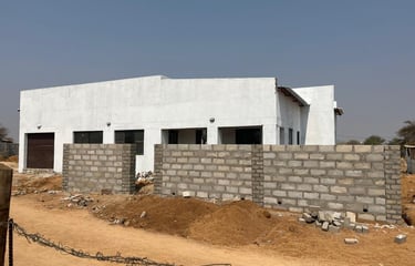 a house with a fenced in area with a fence House Construction Frans-del Investment CC Construction c