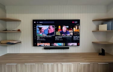 Professional 85 inch LG OLED TV wall mount installation with floating shelf in Brighton Melbourne