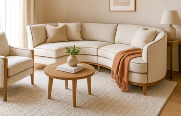 Custom sofa perfectly tailored to a uniquely shaped room, styled with coordinated fabrics for a personalized feel.