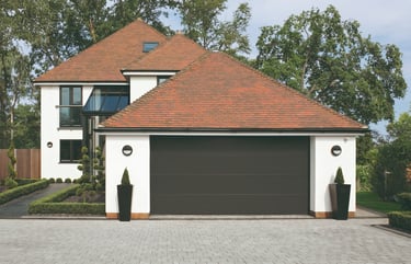 front of a house with a grey garage door