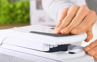 a person is holding a chopper lid