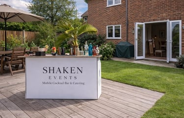 Branded Shaken Events mobile cocktail bar setup for a private garden event.