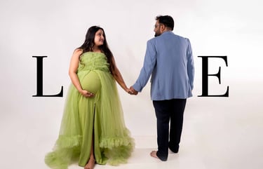 Expecting couple posing during maternity photoshoot in Kolkata