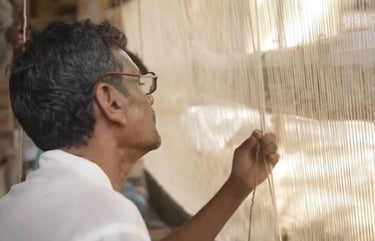 Artisan handknotting a rug in Bhadohi, India
