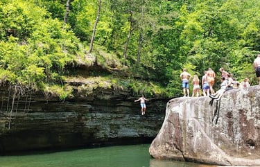 Soddy Daisy, TN - People jumping off a cliff & huge boulder at the Soddy Blue Hole