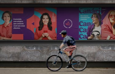 a person riding a bicycle in front of a large advertisement