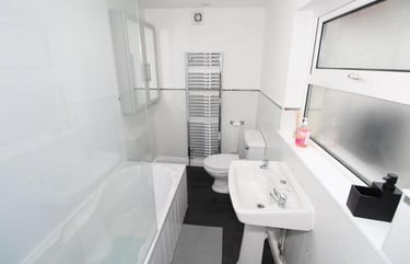 bathroom with over bath shower