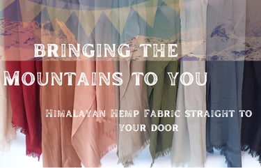 colourful hemp sarongs hanging with himalayan mountain background