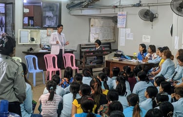 Dr Zaw giving a speech to a group of audience