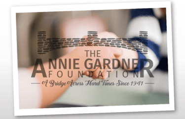 annie gardener foundation logo over holding hands