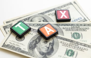 dollar-bills-with-scrabble-tokens-spelling-tax