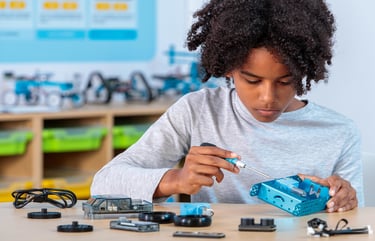 The blue Makeblock mBot2 coding robot with its metal chassis and CyberPI controller on top.
