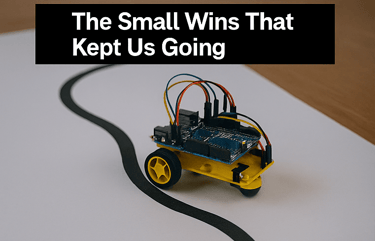 Yellow-wheeled robot car with Arduino and wires mounted, successfully following a black line on pape