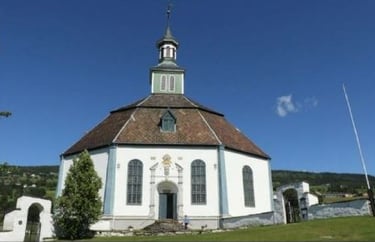 an octagonal white church with a steeple