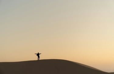 Person atop a hill representing success