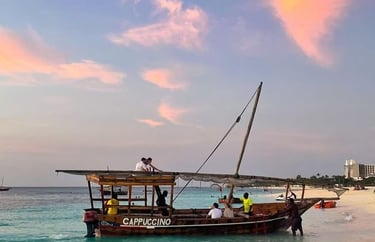 Traditional dhow cruise sailing along the turquoise waters of Zanzibar under a clear sky
