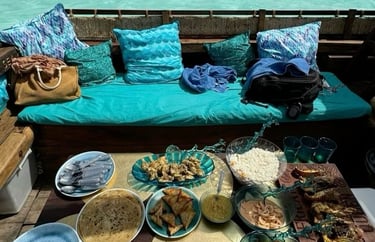 Tourists enjoying delicious local Zanzibar cuisine on a traditional dhow cruise with scenic ocean views