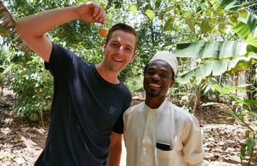 Smiling tourist enjoying a fun photo with a friendly local guide after an exciting Zanzibar spice tour at a traditional spice