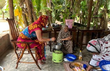 Tourist participating in a step-by-step cooking class coached by a local guide during a luxury Zanzibar spice tour, learning