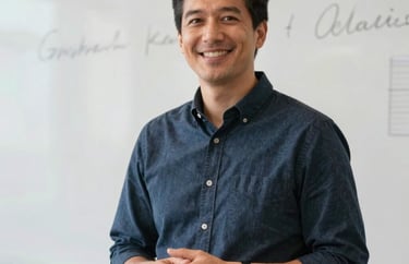 Professional portrait of a skill workshop instructor standing before a whiteboard in a clean North American / US office, bright lighting and friendly expression.