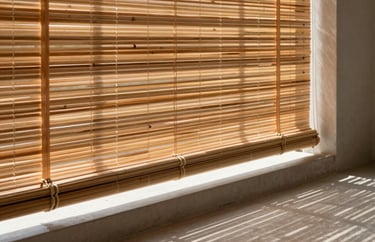 Premium bamboo blinds filtering warm sunlight onto a minimalist concrete balcony floor