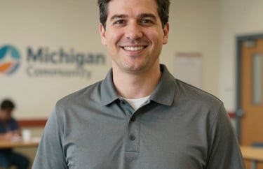Professional portrait of a male health educator in a Michigan community center, wearing a professional polo shirt. Clean, approachable look.