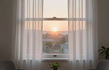 A view of a soft morning sunrise through a window with white curtains, casting a hopeful light into a serene counseling space.
