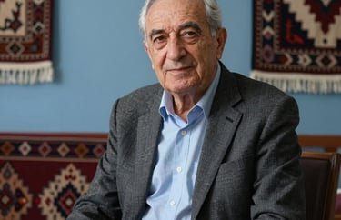 Portrait of a senior math consultant, an elderly gentleman with a kind face, sitting in a room with traditional Anatolian textiles integrated into modern decor, slate blue light.